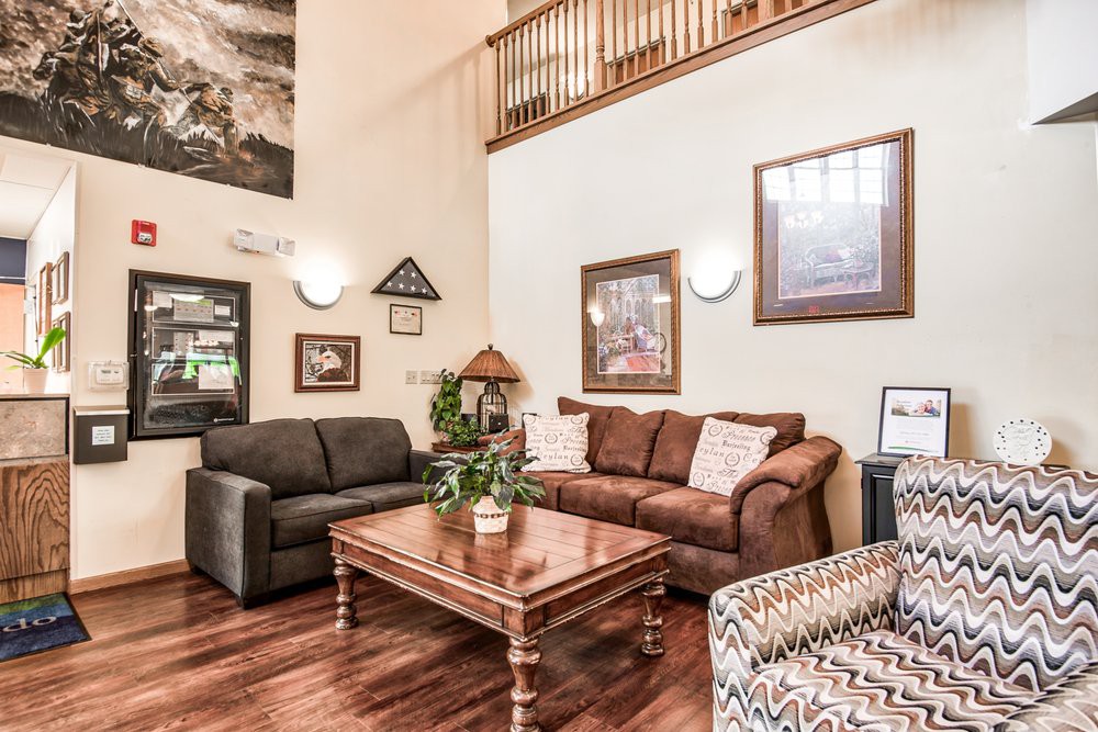A cozy living room with stylish furniture and artwork on the walls.