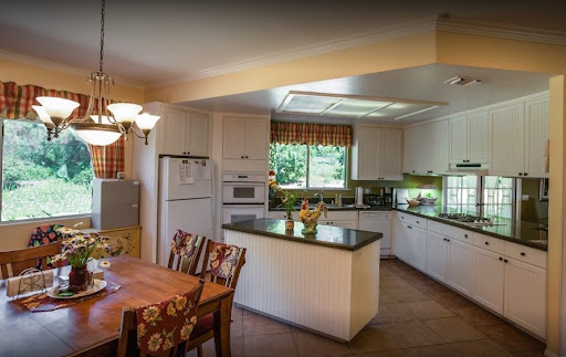 A beautifully designed modern kitchen featuring sleek appliances and a cozy dining area.