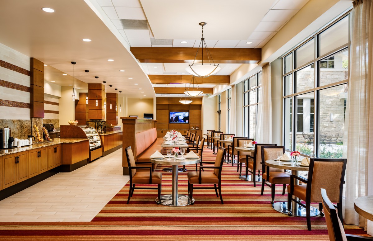 Modern restaurant interior with a neatly arranged dining area.