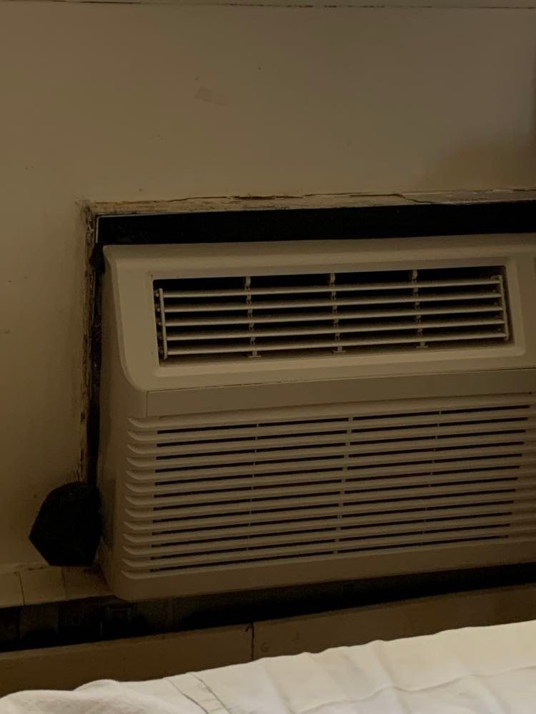 An indoor air conditioning unit attached to a wall.