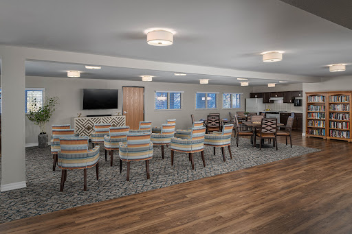 A spacious and modern lounge area featuring comfortable seating and stylish lighting.