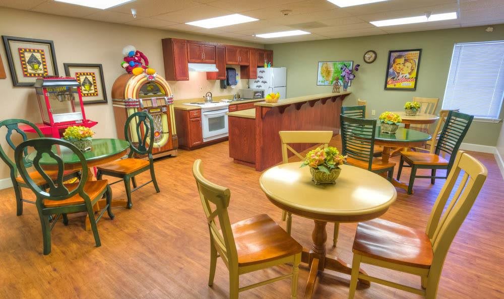 A cozy kitchen and dining area featuring a jukebox and decorative elements.