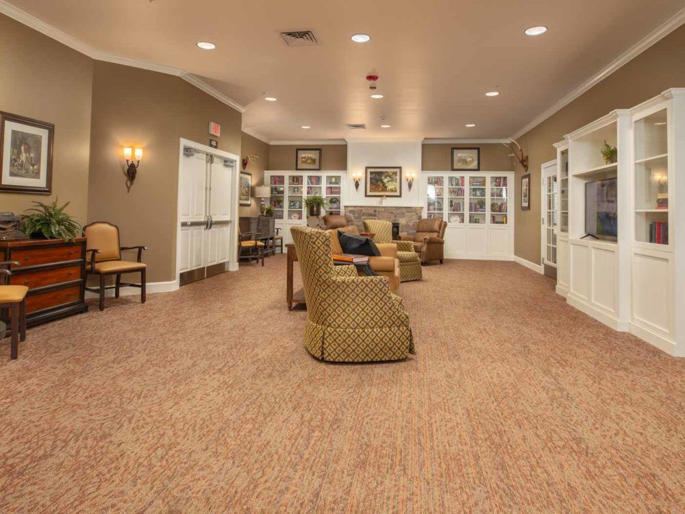 A cozy living room with comfortable seating and warm lighting.