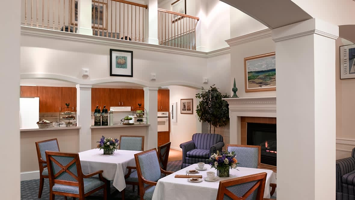 Cozy interior with a dining area, fireplace, and seating.
