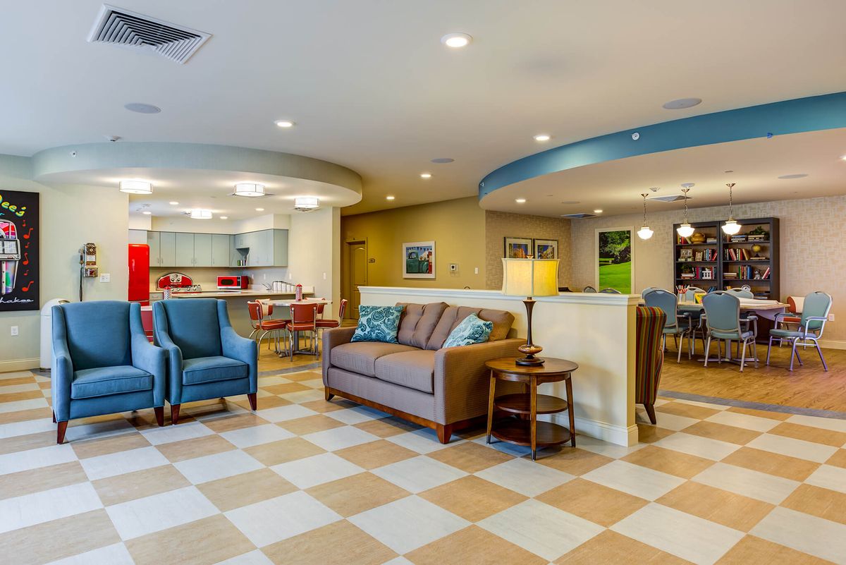 A modern lobby area with comfortable seating and bright lighting.