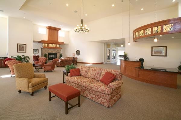A spacious hotel lobby with cozy seating and elegant lighting.