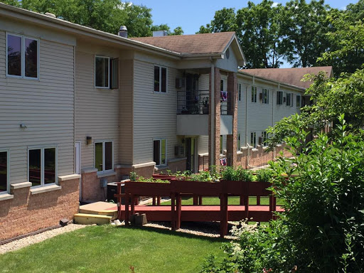 A sunny day at a residential apartment complex featuring a well-maintained outdoor space.