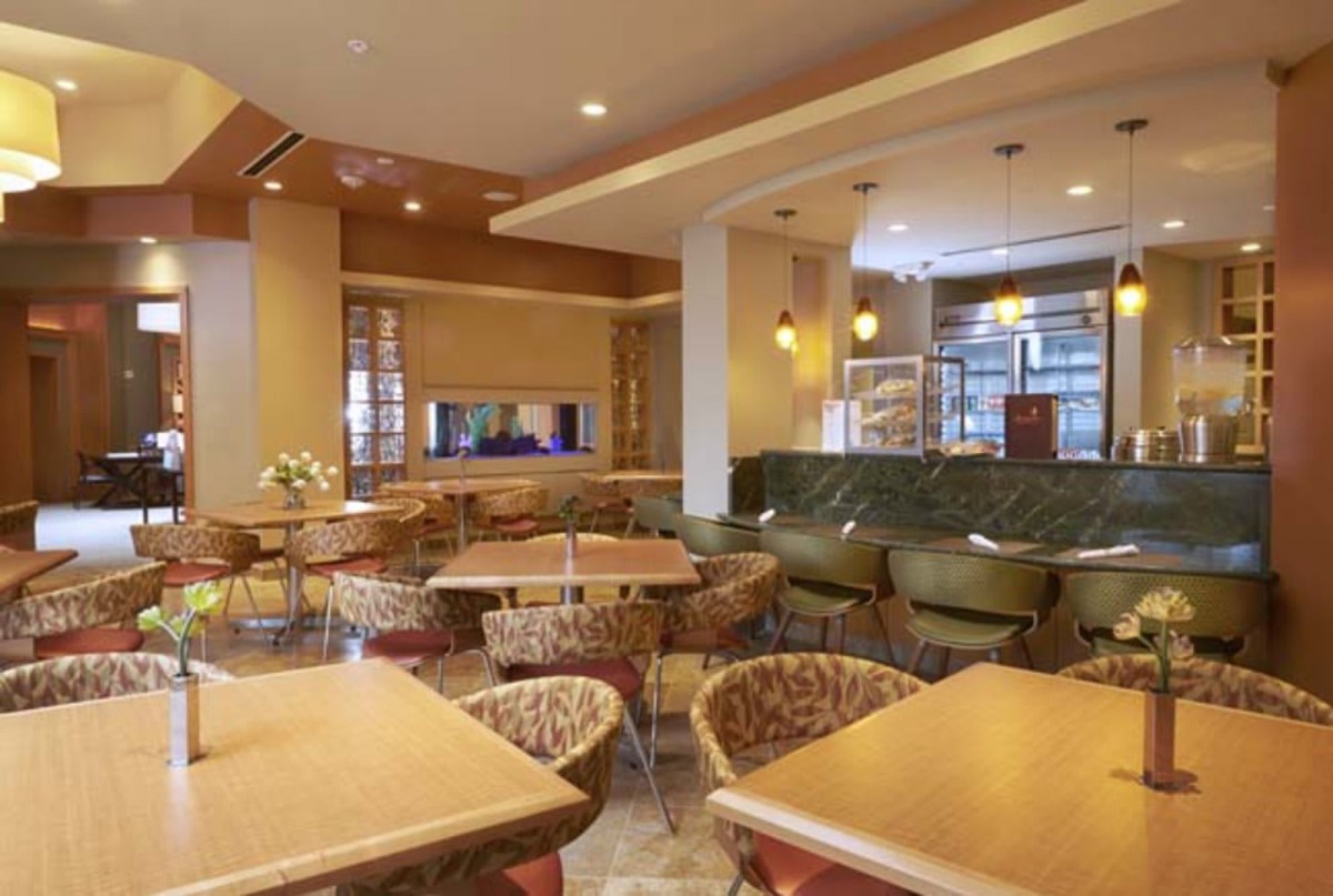 A modern restaurant interior with stylish seating and ambient lighting.