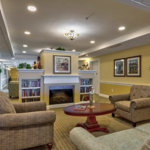 A cozy living room with comfortable seating and a fireplace.