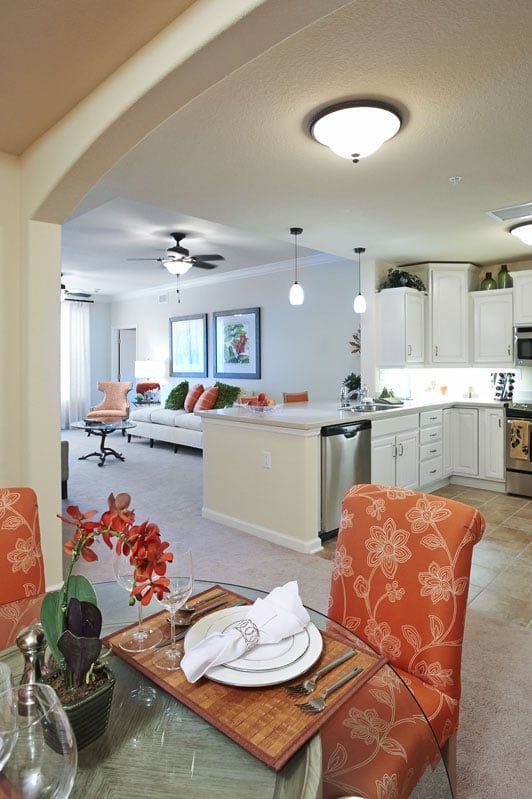 A modern open-concept kitchen and living room with a dining area.