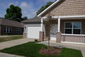 A suburban house with a garage and a small front yard.