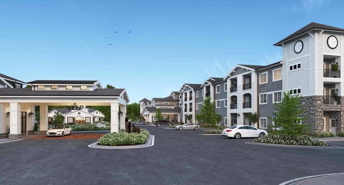 A modern apartment complex with landscaped surroundings and a parking area.