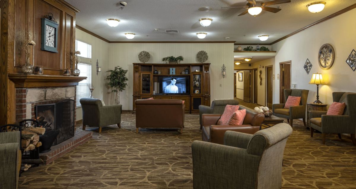 A cozy living room with comfortable seating and a television.