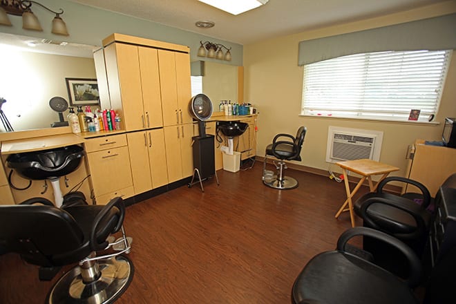 A spacious salon interior with modern equipment and comfortable seating.
