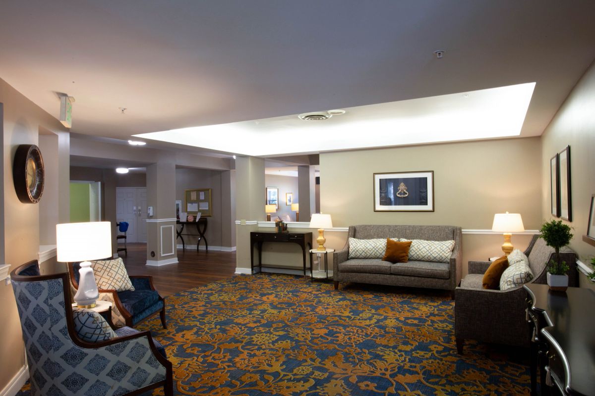 A well-decorated living room with comfortable seating and elegant decor.