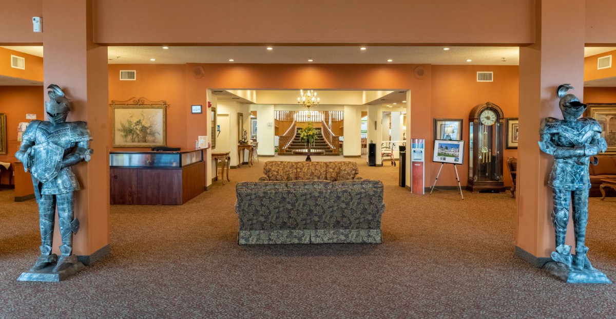 Spacious lobby with a reception desk and comfortable seating area.