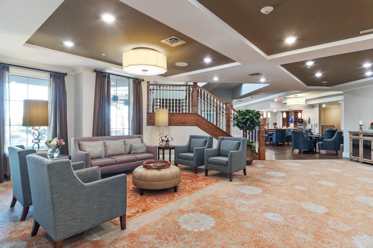 A modern hotel lobby featuring comfortable seating and elegant decor.