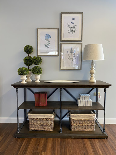 A stylish console table adorned with decorative elements and art.