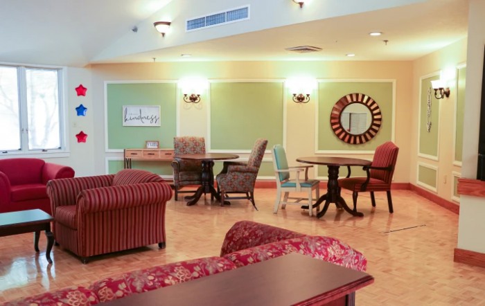 A cozy lounge area with comfortable seating and warm lighting.