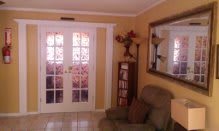 A cozy living room with a comfortable armchair and decorative elements.