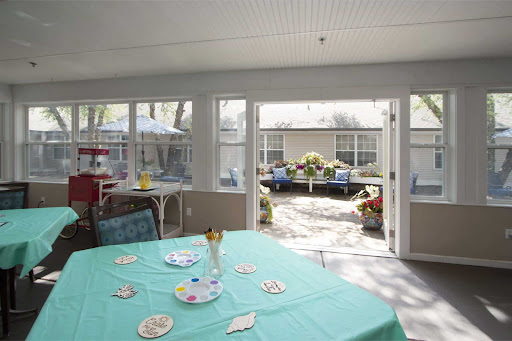 A bright and inviting dining area with a view of a lovely outdoor space.