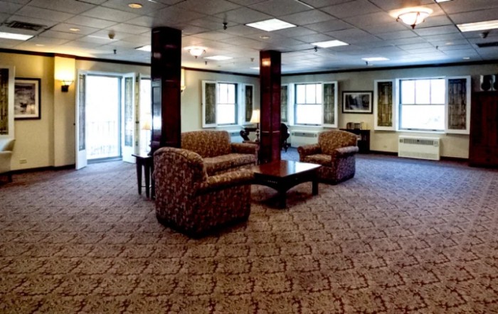 A spacious lobby with comfortable seating and elegant furnishings.