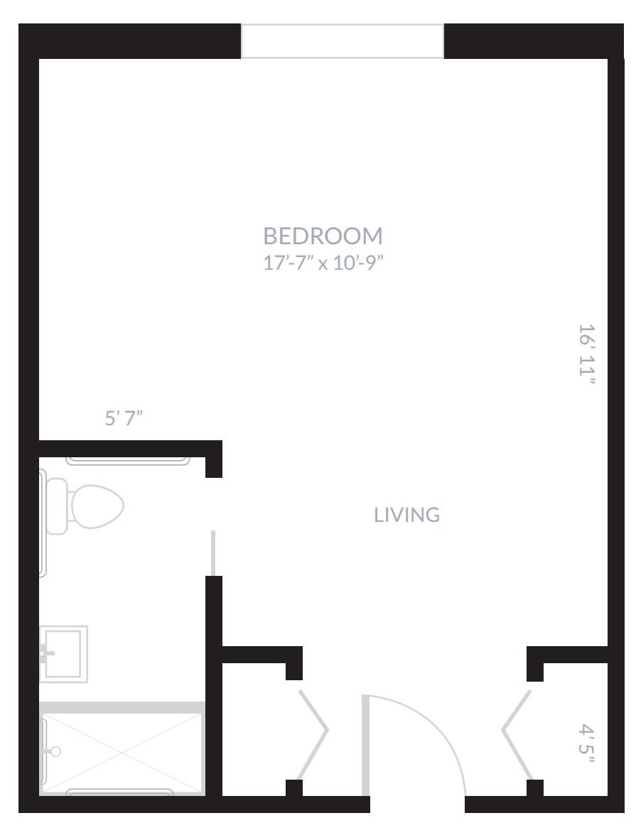 A floor plan showing the layout of a living space with a designated bedroom and living area.