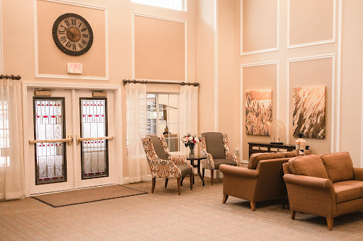 A cozy and elegant lounge area featuring comfortable seating and tasteful decor.