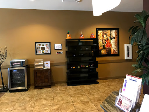 A welcoming reception area featuring modern decor and a selection of beverages.