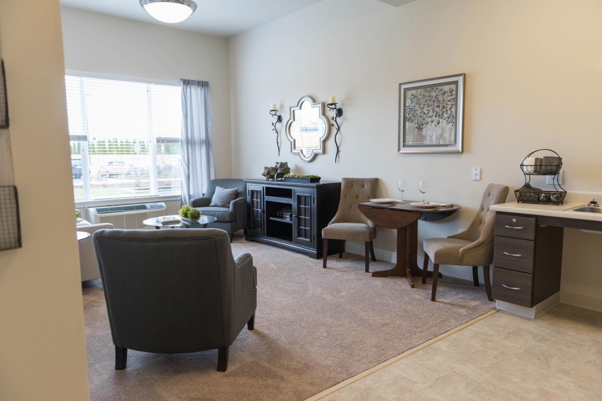 A well-decorated living room with comfortable seating and stylish decor.