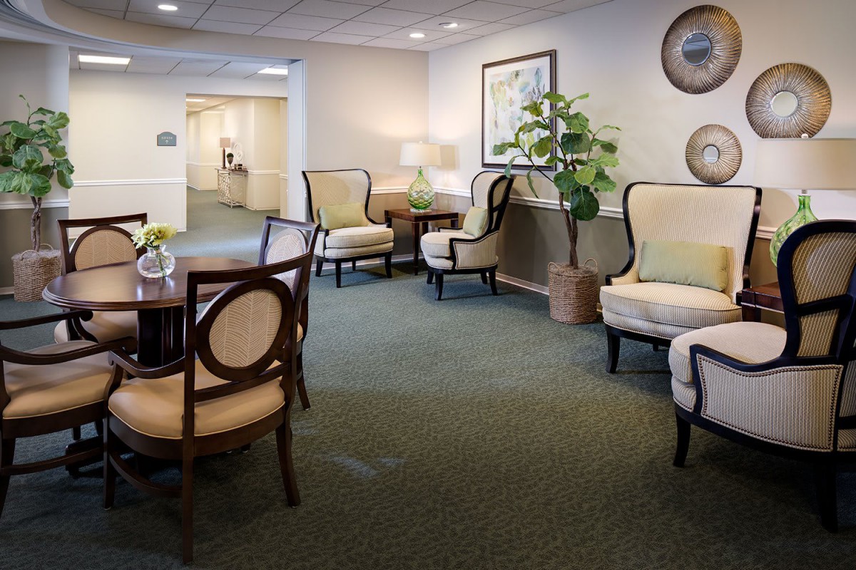 A comfortable and stylish lobby area featuring elegant furniture and decorative plants.