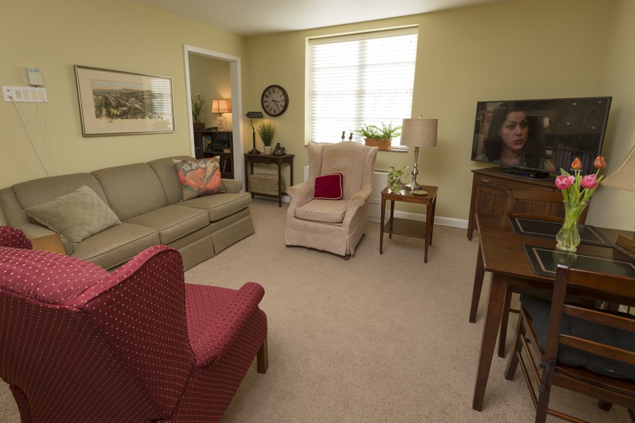 A cozy living room with comfortable seating and a television.