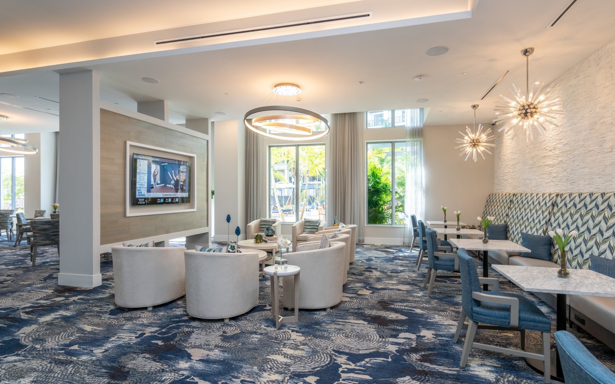 A modern living room with elegant furnishings and stylish light fixtures.