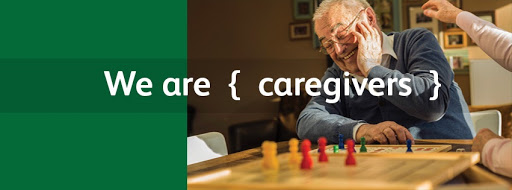 Engaging in a board game, showcasing the essence of caregiving and connection.