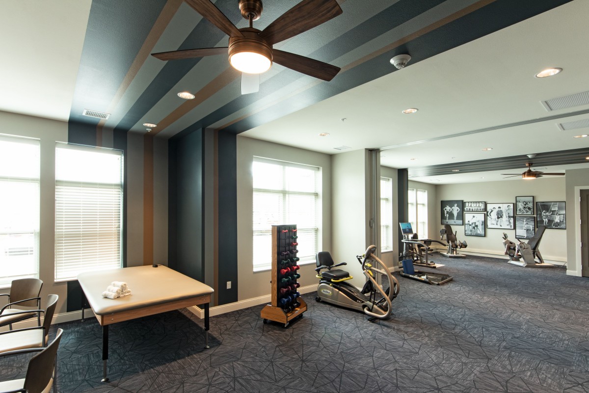 A modern fitness center featuring exercise bikes and a well-lit workout space.