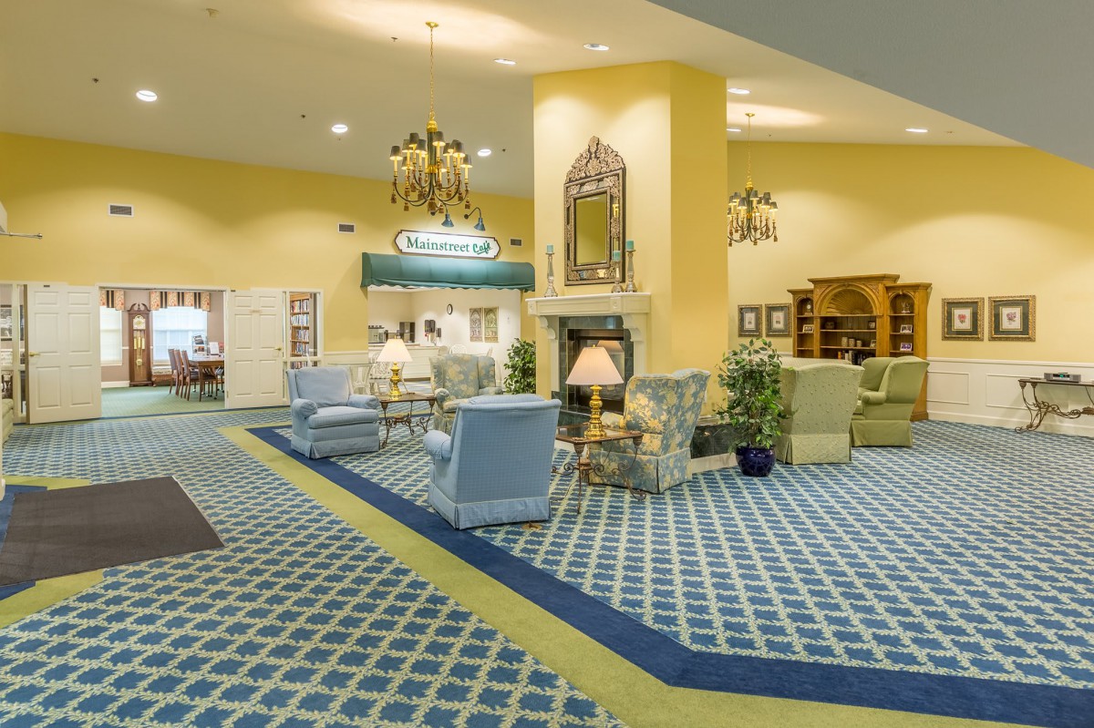 Spacious hotel lobby with elegant furniture and vibrant decor.