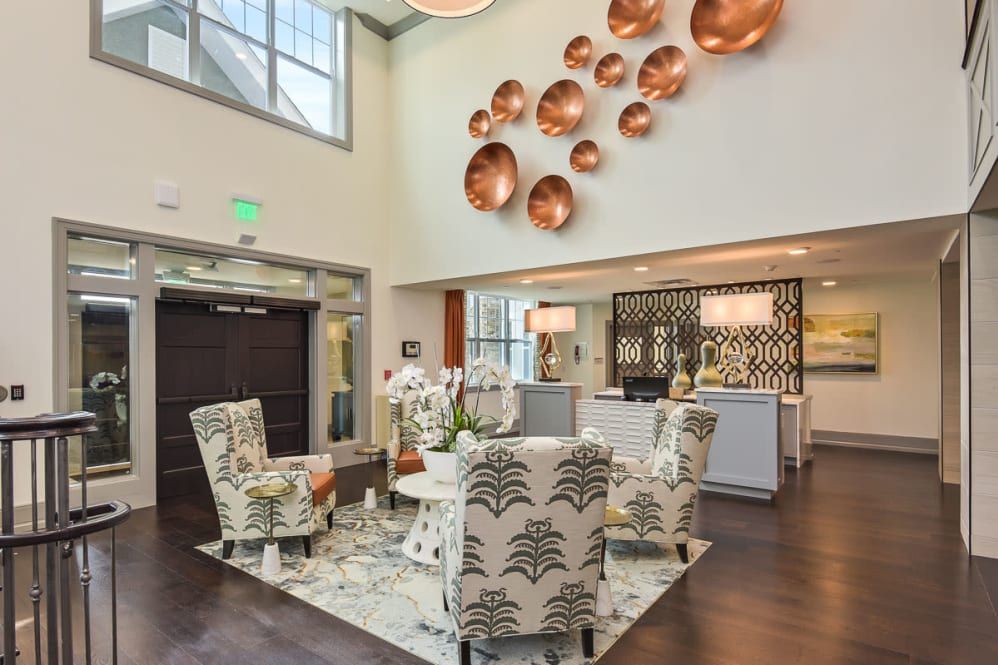 A modern lobby with stylish furniture and decorative wall art.