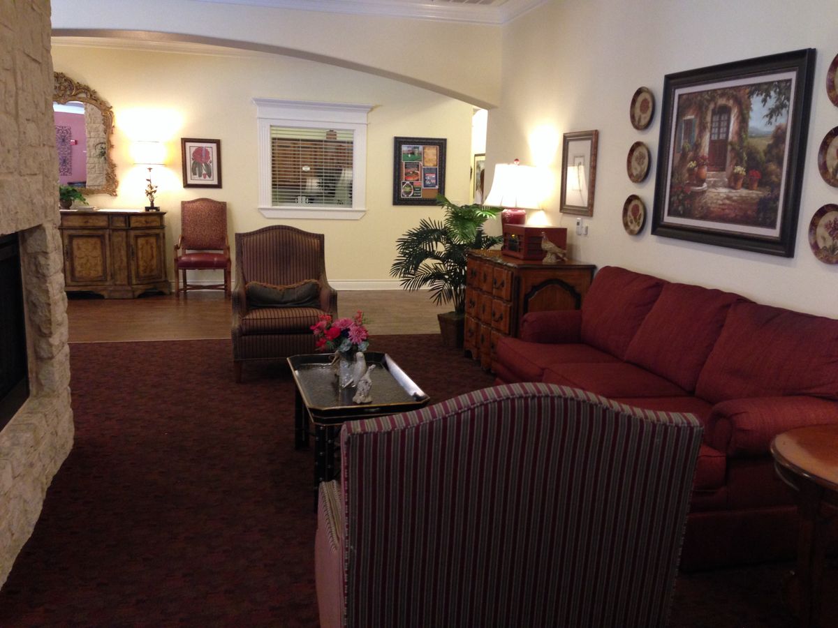 Cozy living room with elegant furniture and warm decor.