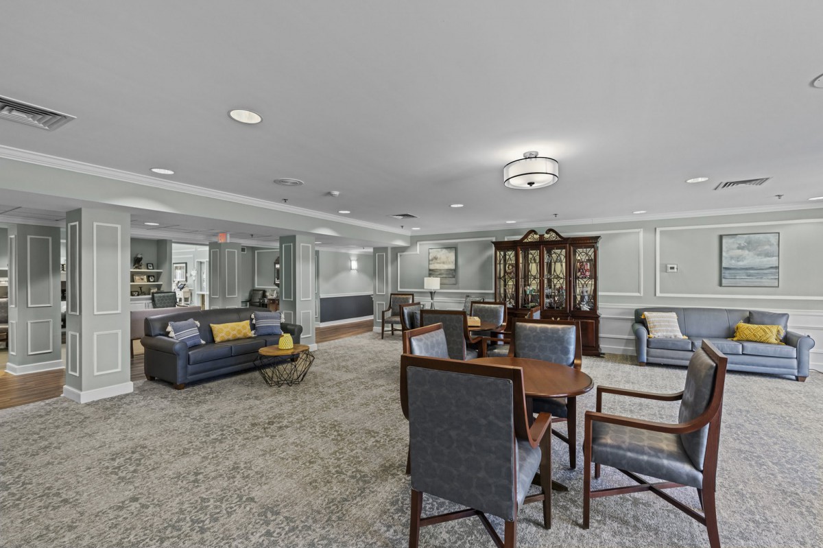 A spacious living room with comfortable seating and elegant decor.