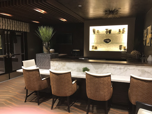 A stylish modern lounge bar featuring elegant seating and ambient lighting.