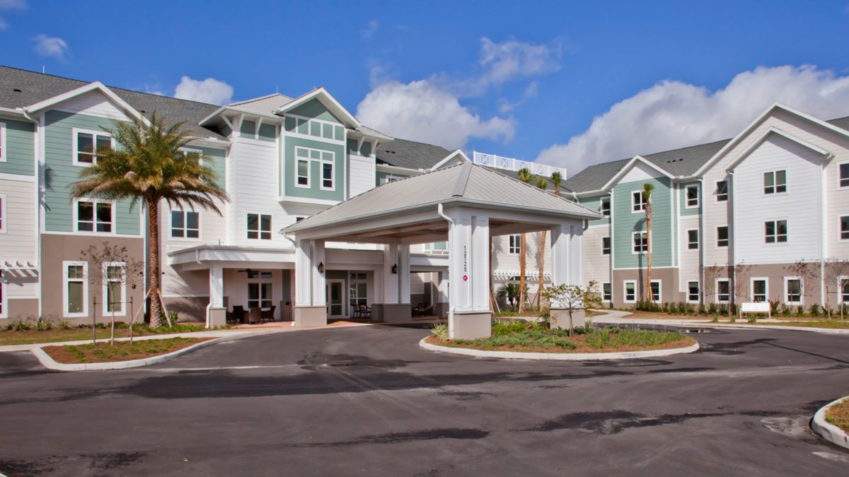 A modern residential building with a welcoming entrance and well-maintained landscaping.