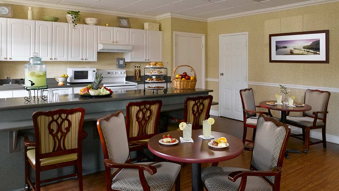 A cozy kitchen and dining area with elegant furniture and decor.