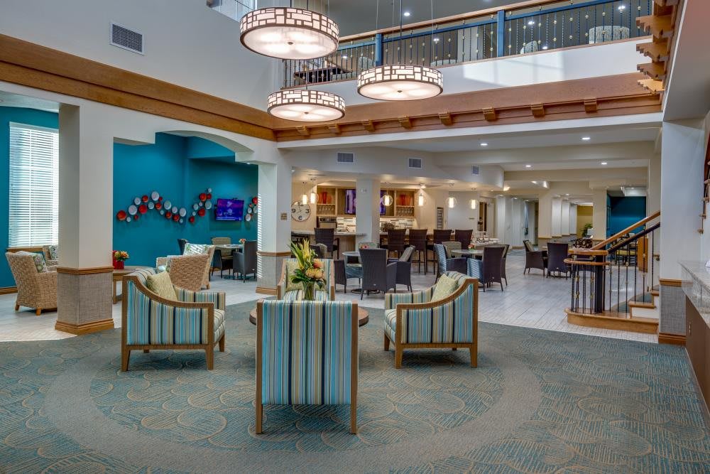 A modern hotel lobby with comfortable seating and elegant lighting.