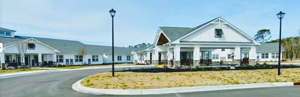 A suburban residential area featuring modern houses and a lamp post.
