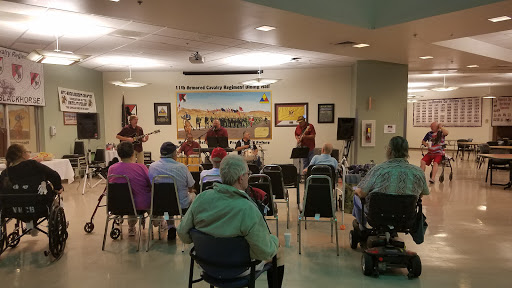 A live music performance in a community center, engaging a senior audience.