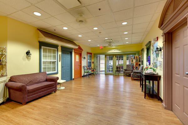 A spacious lobby area with comfortable seating and warm decor.