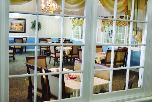 A cozy dining room setup with elegant furniture and a welcoming atmosphere.