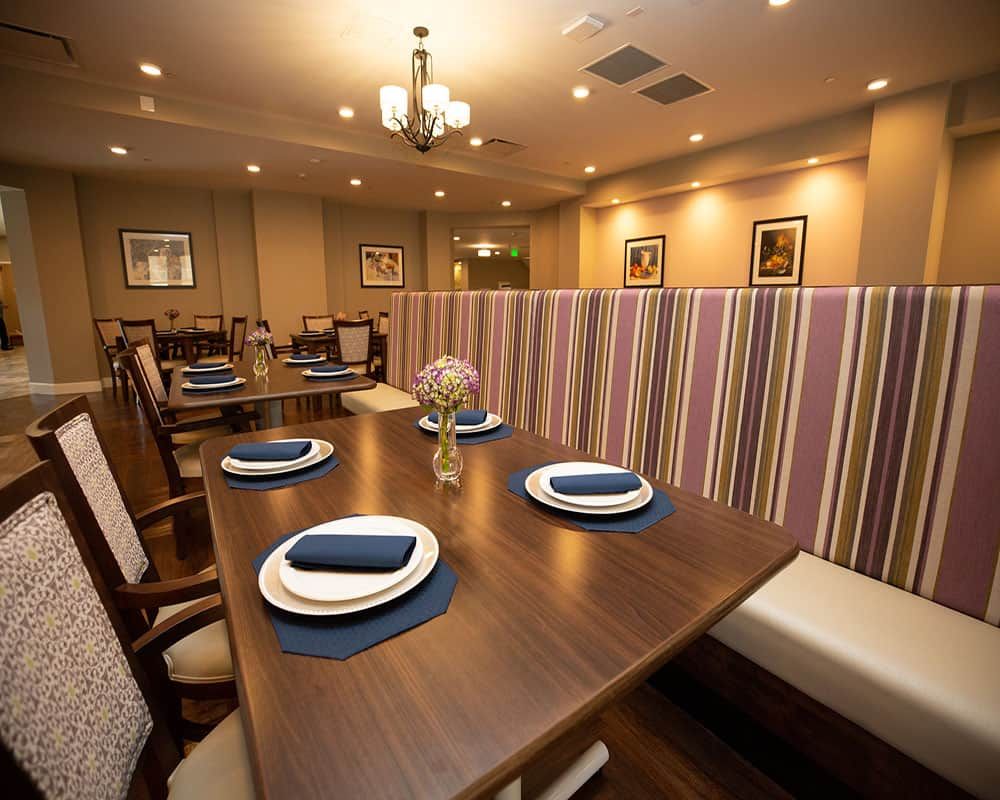 A beautifully set dining area in a restaurant with stylish decor and ambient lighting.