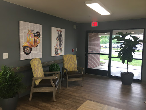 A cozy lobby space with artistic decor and comfortable seating.