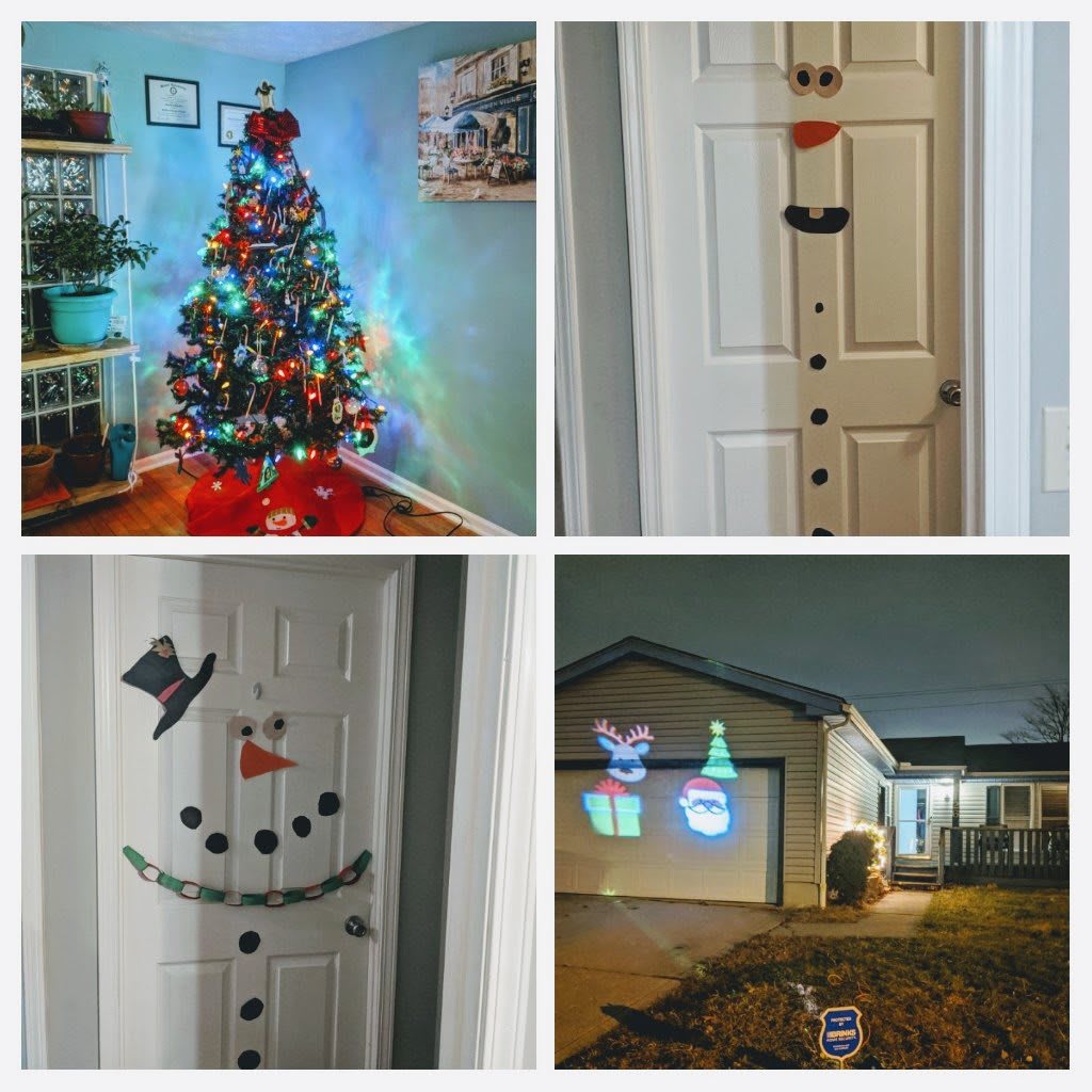Festive holiday decorations featuring a colorful Christmas tree, creative door snowmen, and outdoor projections.